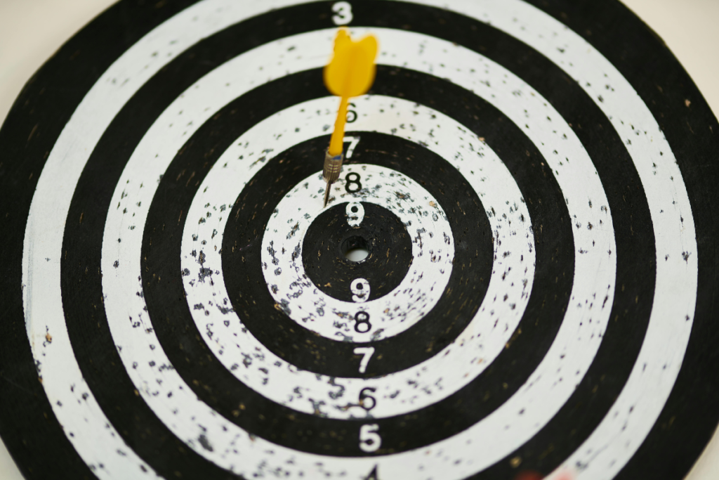 Image of a person writing down goals aligned with their identity, reflecting personal growth and commitment to a healthy lifestyle.